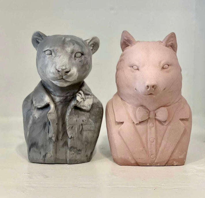 A puma and a wolf concrete animal bookend made by Queen City Crete. 