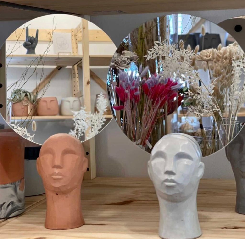 Franco Concrete Head Sculptures with Mirrors reflect scenes from the store Concrete Jungle, home to the most of Queen City ‘Cretes collection. 