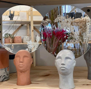 Franco Concrete Head Sculptures with Mirrors reflect scenes from the store Concrete Jungle, home to the most of Queen City ‘Cretes collection. 