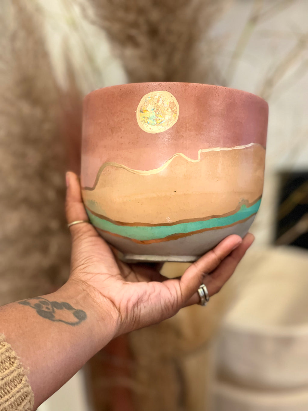 Moon Mila- brownish pink, tangerine, teal, and grey